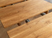 Minimalistische Essgruppe aus massiver Eiche | Runder Ausziehtisch Orbetello + 4x Polsterstuhl Leon - 